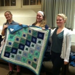 Quilters with their work