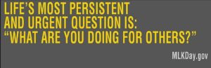 Banner reading Life's most persistent and urgent question is: "What are you doing for others?"