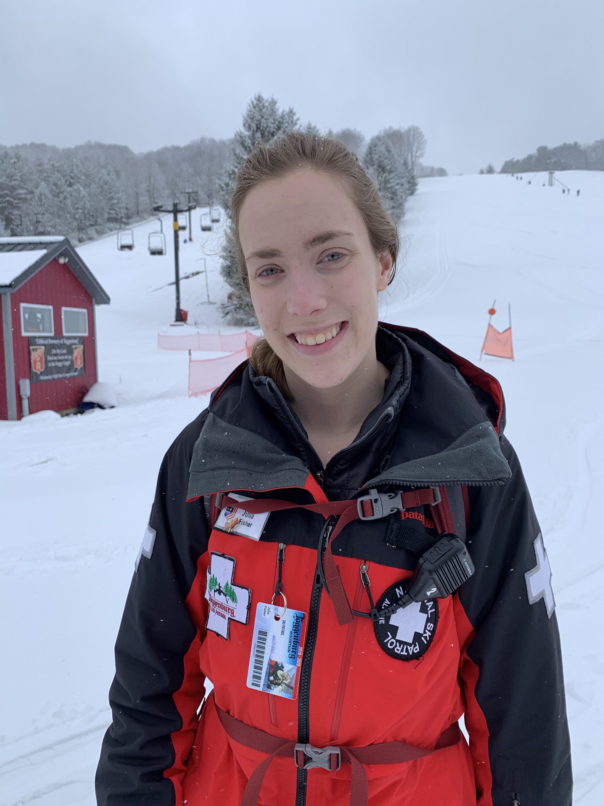 Julia-Cleo-Fisher in her ski patrol uniform on the slopes