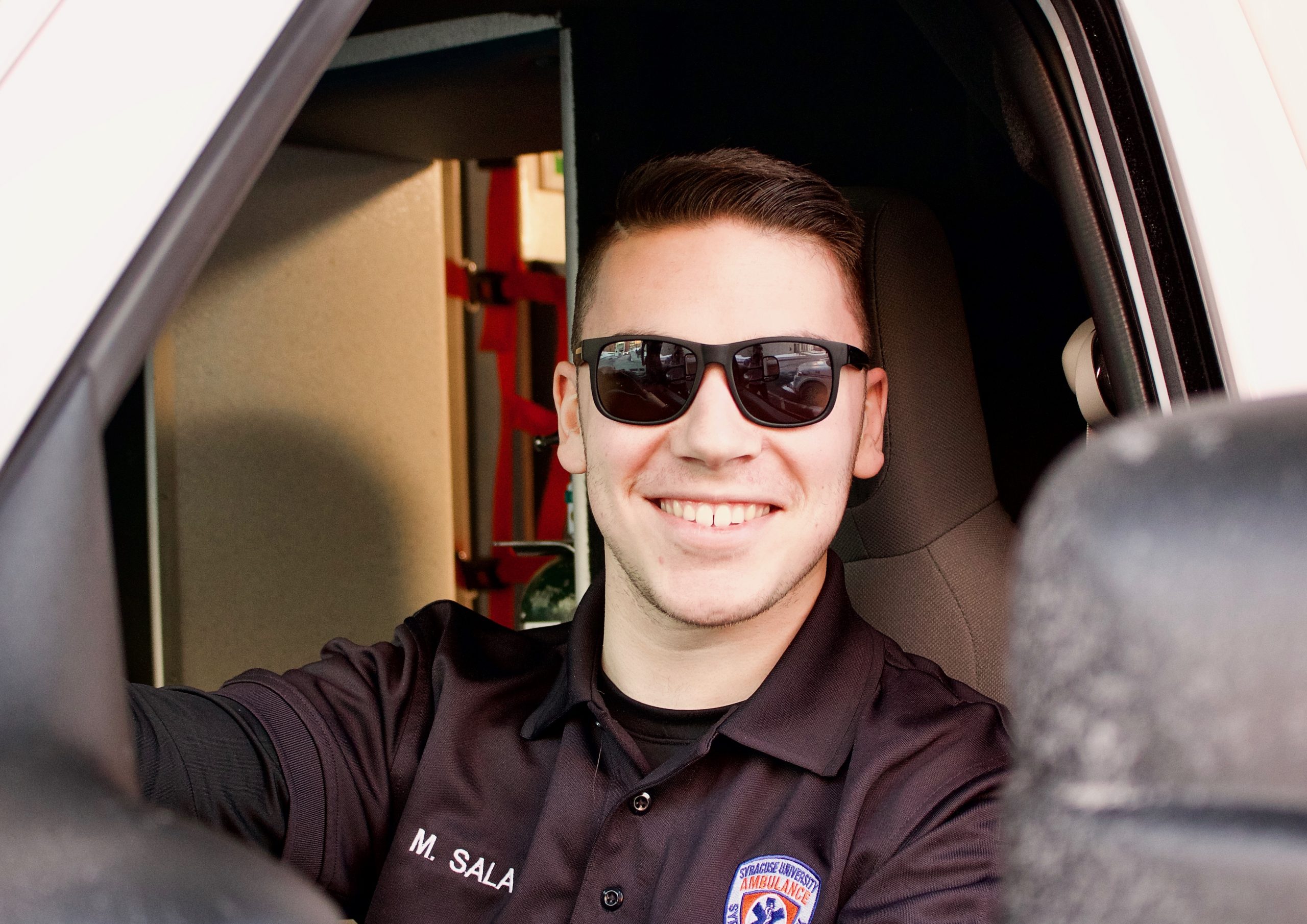 Matthew-Sala in SUA uniform sitting in ambulance
