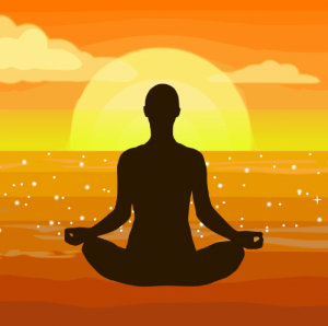Silhouette of human in seated meditation pose against orange and yellow sunset