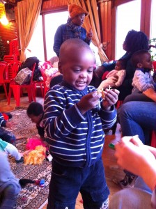 Mohammad playing at the Moms and Tots Program