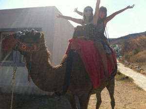 Rebecca riding a camel
