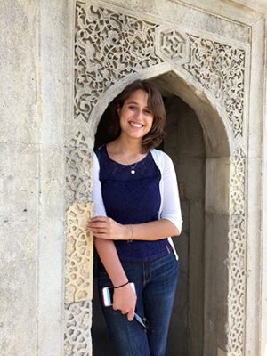 Giovanna Saccoccio posing under an archway