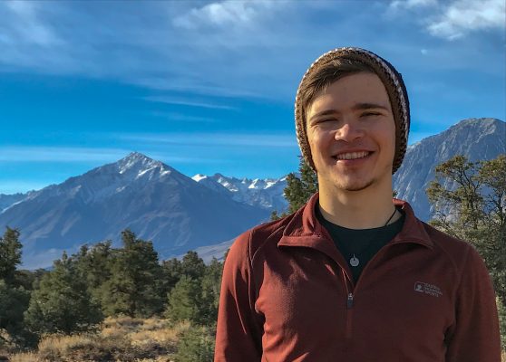 Garet Bleir in front of mountain, smiling