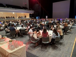 students gathered around tables