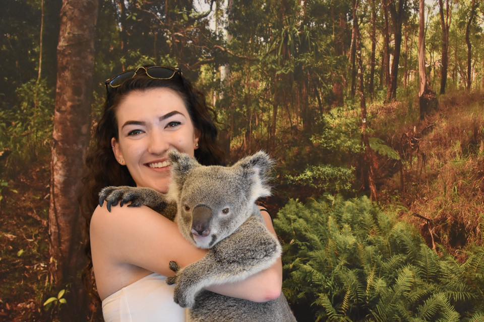 student in Australia with koala