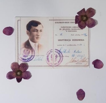 faded picture of an old id card surrounded by flower petals