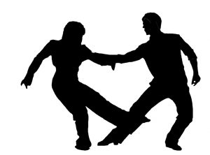 male and female silhouettes positioned in dance move