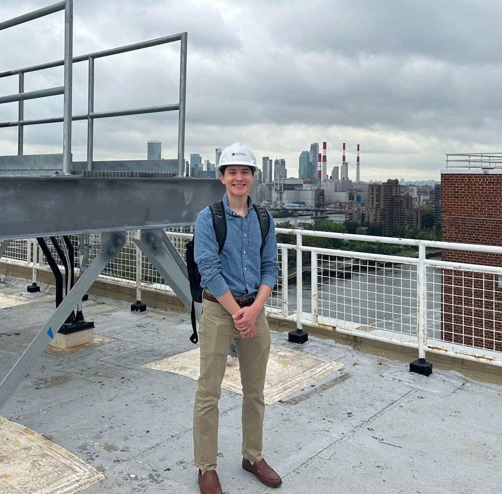 Aaron atop a building with O'Donnel & Naccarato Structural Engineers.